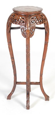Lot 44 - A Chinese dark wood urn stand, Qing Dynasty