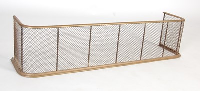 Lot 13 - A late 19th/ early 20th century brass and wire mesh nursery fire fender