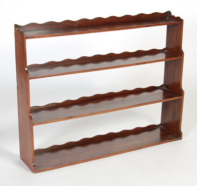 Lot 12 - A George III mahogany graduated hanging shelf