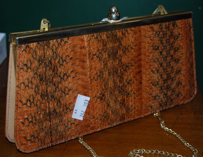 Lot 352 - A faux snakeskin clutch bag.
