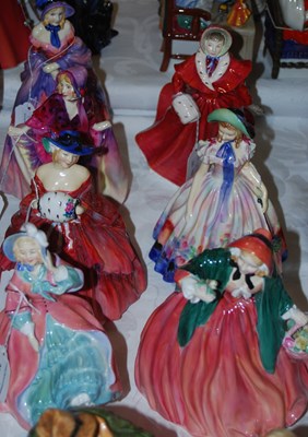 Lot 394 - A group of seven Royal Doulton lady figures...