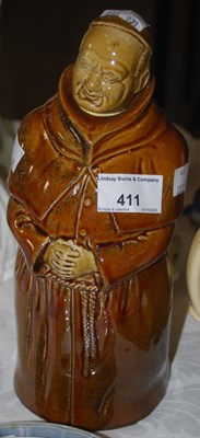 Lot 411 - A stoneware decanter in the form of a monk for...