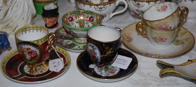 Lot 414 - A collection of Continental porcelain cups and...