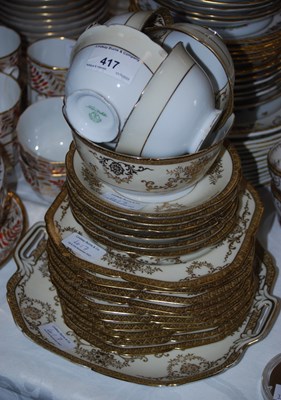 Lot 417 - A Noritake part tea set, the off-white borders...
