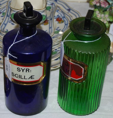 Lot 428 - Two vintage apothecary glass jars, one blue...