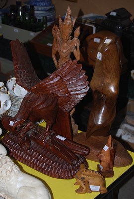 Lot 449 - A group of carved wooden figures comprising an...