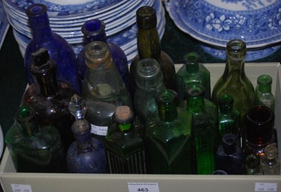 Lot 463 - A collection of assorted coloured bottles to...