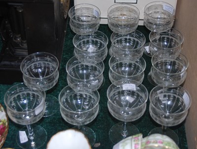 Lot 468 - A suite of fourteen etched dessert glasses.