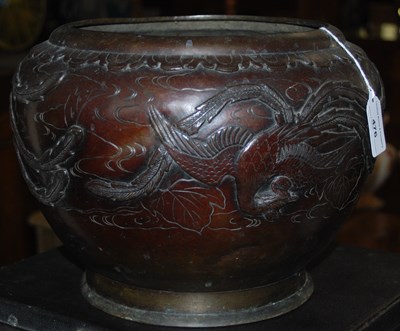 Lot 476 - A Japanese bronzed jardiniere embossed with a...