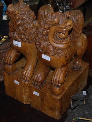 Lot 480 - A pair of carved wooden Chinese Dogs of Foo/...