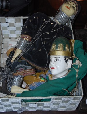 Lot 487 - Two carved wooden hand-painted puppets, a male...
