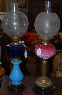Lot 499 - A late 19th/ early 20th century oil lamp, a...