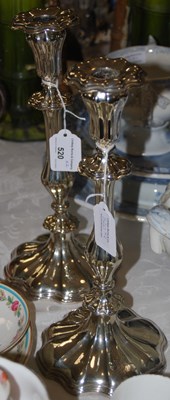 Lot 520 - A pair of white metal ornate candlesticks...