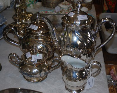 Lot 539 - A four-piece silvered ceramic tea set by...