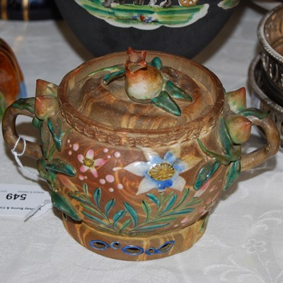 Lot 549 - An enamelled pottery twin-handled jar and...