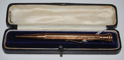Lot 54 - A yellow metal propelling pencil stamped '9CT',...