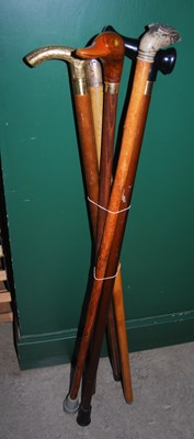 Lot 663 - A collection of six assorted walking canes.