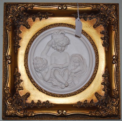 Lot 789 - Two circular composite wall plaques mounted in...