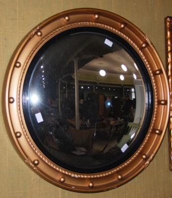 Lot 796 - A Regency style convex gilt framed wall mirror.