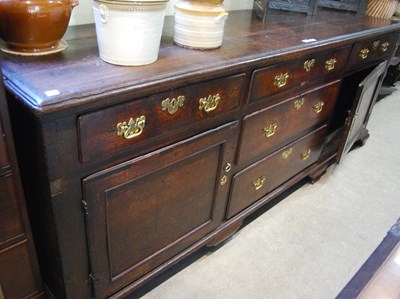 Lot 799 - A George III oak dresser base, the rectangular...