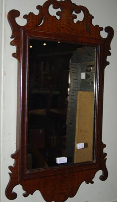 Lot 803 - A mahogany fret cut rectangular wall mirror...