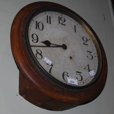 Lot 814 - An early 20th century oak circular cased wall...