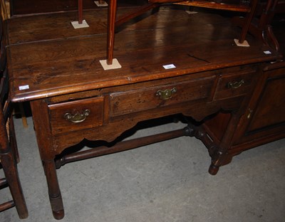 Lot 822 - A late 18th/ 19th century oak lowboy, the...