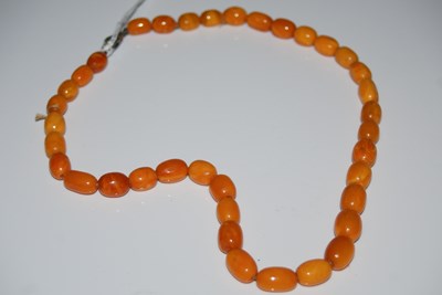 Lot 263 - A vintage butterscotch amber type bead...