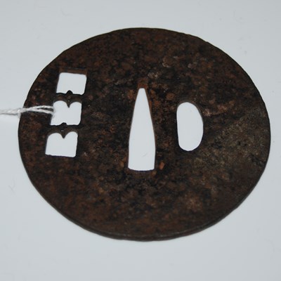 Lot 275 - An antique Japanese cast iron Tsuba,...