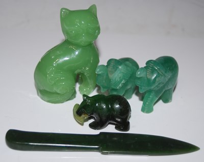 Lot 274 - A group of green hardstone carvings to include...