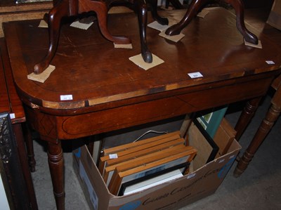 Lot 827 - A 19th century mahogany fold-over games / card...
