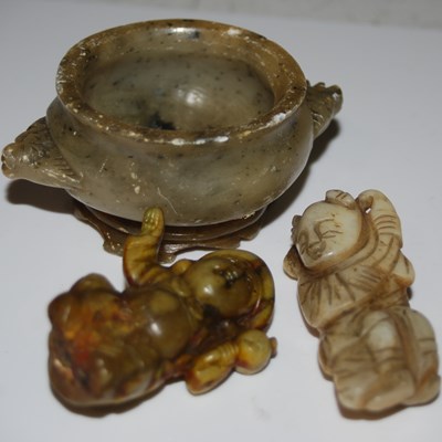 Lot 299 - A Chinese carved green stone figure of a boy,...