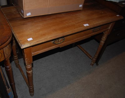 Lot 829 - A blonde wood side table with single frieze...