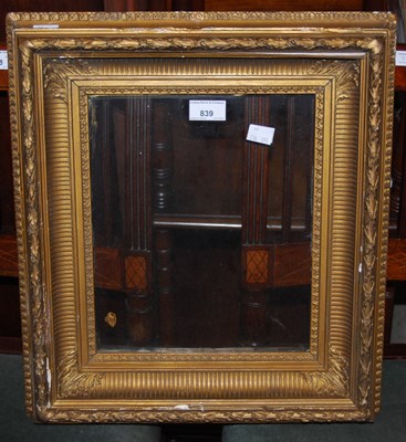 Lot 839 - A gilt picture frame with glass panel.