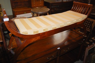 Lot 843 - A walnut twin seat X-framed window bench with...