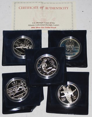 Lot 285 - Five assorted commemorative silver one dollar...