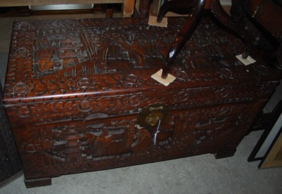 Lot 848 - A Chinese carved camphor wood blanket box.