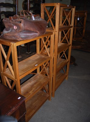 Lot 854 - A near pair of blonde wood storage shelves...