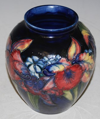 Lot 200 - A Moorcroft pottery vase, decorated with iris...