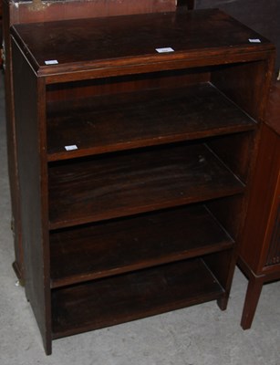 Lot 858 - A stained oak open bookcase together with a...