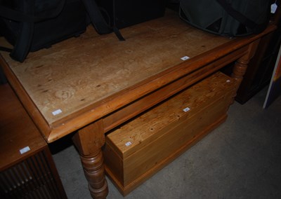 Lot 862 - A pine dining table raised on four turned...