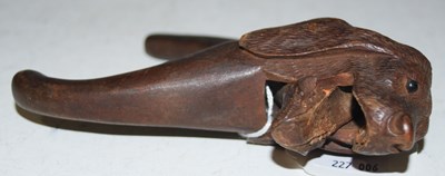 Lot 216 - A vintage treen nutcrack carved in the form of...