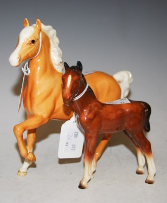 Lot 212 - A Beswick figure of a caramel coloured horse,...