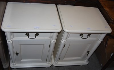 Lot 897 - A pair of white coloured bedside lockers with...