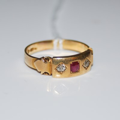 Lot 91 - An 18ct gold ruby and diamond set three stone...