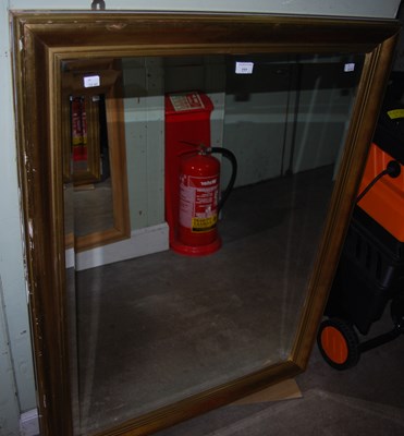 Lot 777 - A modern gilt framed rectangular bevelled wall...