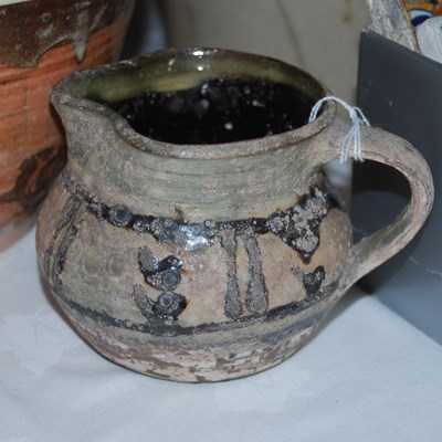 Lot 437 - Studio Pottery Interest - a slip glazed jug by...
