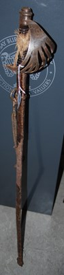 Lot 658 - A metal basket hilted sword in a leather...