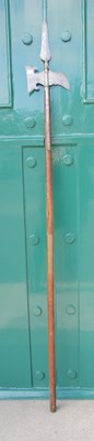 Lot 659 - An antique halberd / pole axe, the axe...