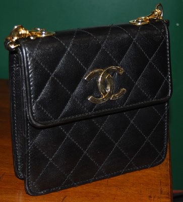 Lot 353 - A quilted leather ladies handbag bearing label...